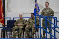 Col. Matthew D. Calhoun, outgoing 131st Bomb Wing commander, and Col. Jared P. Kennish, incoming 131st Bomb Wing commander, share a smile during a change of command ceremony as Chief Master Sgt. Jason R. Henke, Command Chief Master Sergeant of the 131st Bomb Wing, bears the guidon at Whiteman Air Force Base, Missouri, Feb. 3, 2023. During the ceremony Col. Jared P. Kennish assumed command of the 131st Bomb Wing from Col. Matthew D. Calhoun. (U.S. Air National Guard photo by Senior Airman Kelly C. Ferguson)