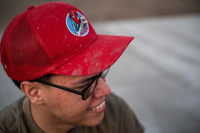 Airman First Class Andres Baez, 819th RED HORSE Squadron Pavements and Equipment operator, prepares to assist in pouring concrete at Basa Air Base, Philippines, January 25, 2023. Airmen from the 819th RED HORSE Squadron out of Malmstrom Air Force Base, Montana, traveled to the Philippines and worked alongside their Philippine Air Force counterparts in a Field Training Event, Jan. 23 through Feb. 3. (U.S. Air Force photo by Tech. Sgt. Hailey Haux)