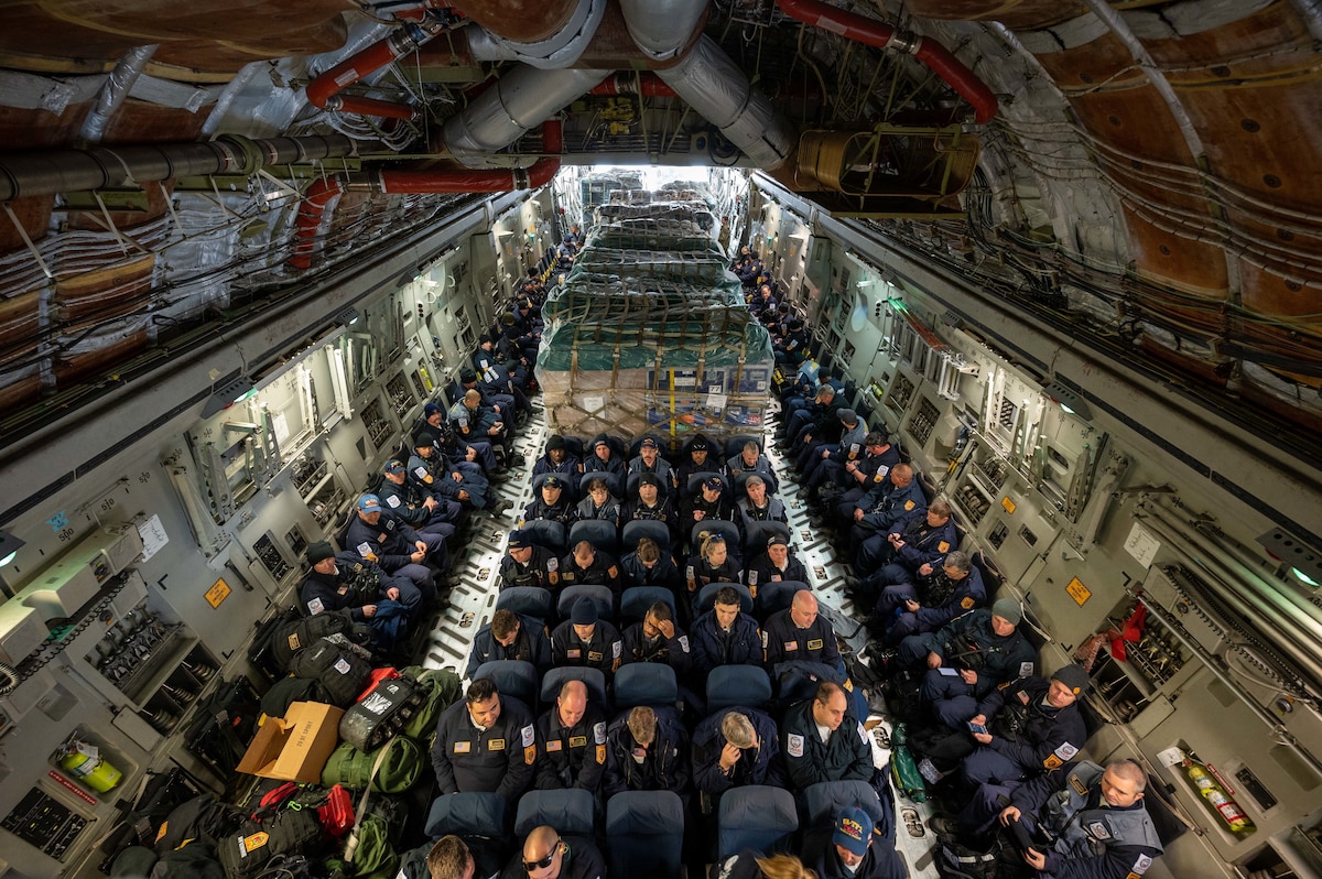 Urban Search and Rescue members from Fairfax County, Virginia, are boarded onto a C-17 Globemaster III on Dover Air Force Base, Delaware, Feb. 7, 2023. The U.S. Agency for International Development (USAID) is mobilizing emergency humanitarian assistance to respond to the devastating impacts in Türkiye following the worst earthquake to hit the region in almost a century. (U.S. Air Force photo by Senior Airman Faith Barron)