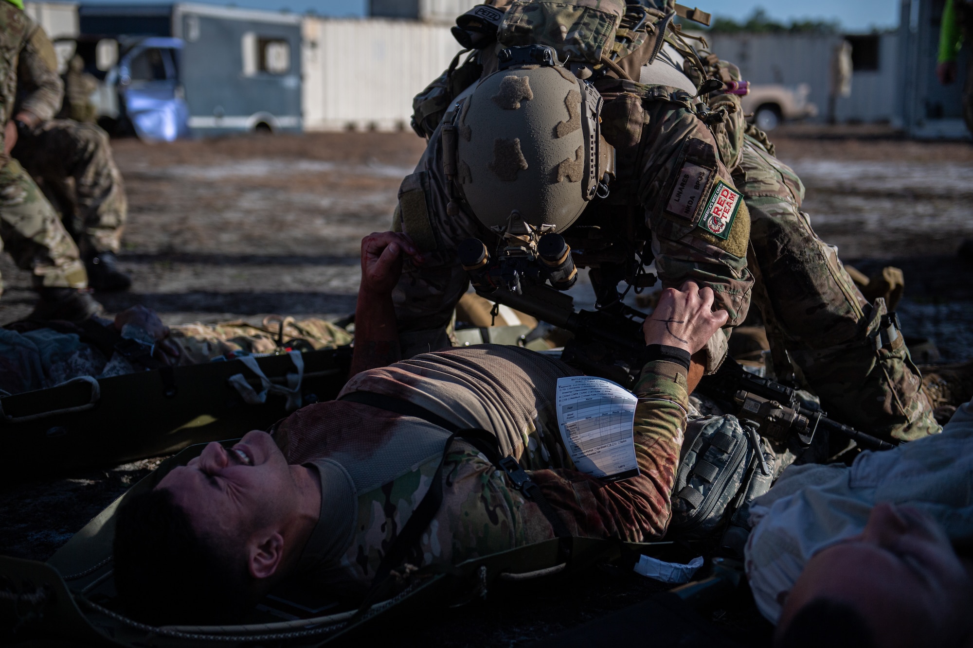 A photo of an Airmen treating a patient.