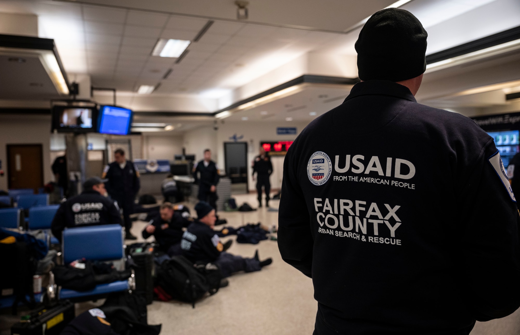 Urban Search and Rescue personnel from Fairfax County, Virginia, gather their belongings prior to boarding a C-17 Globemaster III on Dover Air Force Base, Delaware, Feb. 7, 2023. The U.S. Agency for International Development (USAID) is mobilizing emergency humanitarian assistance to respond to the devastating impacts in Türkiye following the worst earthquake to hit the region in almost a century. (U.S. Air Force photo by Staff Sgt. Marco A. Gomez)