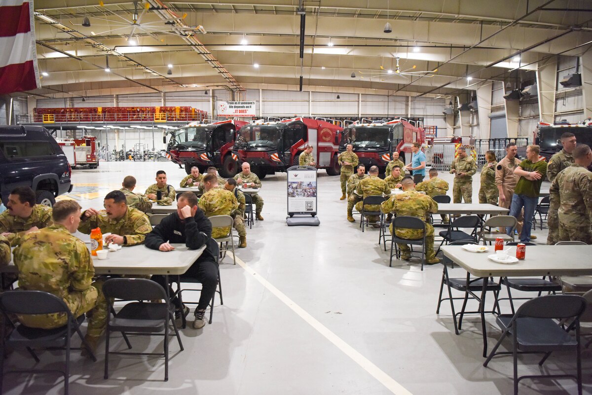 Members of the 312th Training Squadron come together to eat lunch during Operation Feed Everyone at the Louis F. Garland Department of Defense Fire Academy, on Goodfellow Air Force Base, Texas, Feb. 6, 2023. The Goodfellow First Sergeants Council organized the event to treat members to a meal. (U.S. Air Force photo by Staff Sgt. Tyrell Hall)
