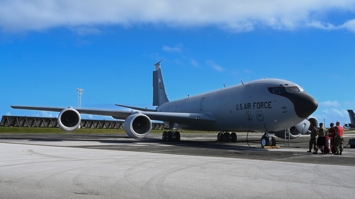 U.S. Air Force personnel stand next to a U.S. Air Force KC-135 Stratotanker assigned to 128th Air Refueling Wing, Wisconsin Air National Guard, that recently arrived at Andersen Air Force Base, Guam, Feb. 3, 2023.