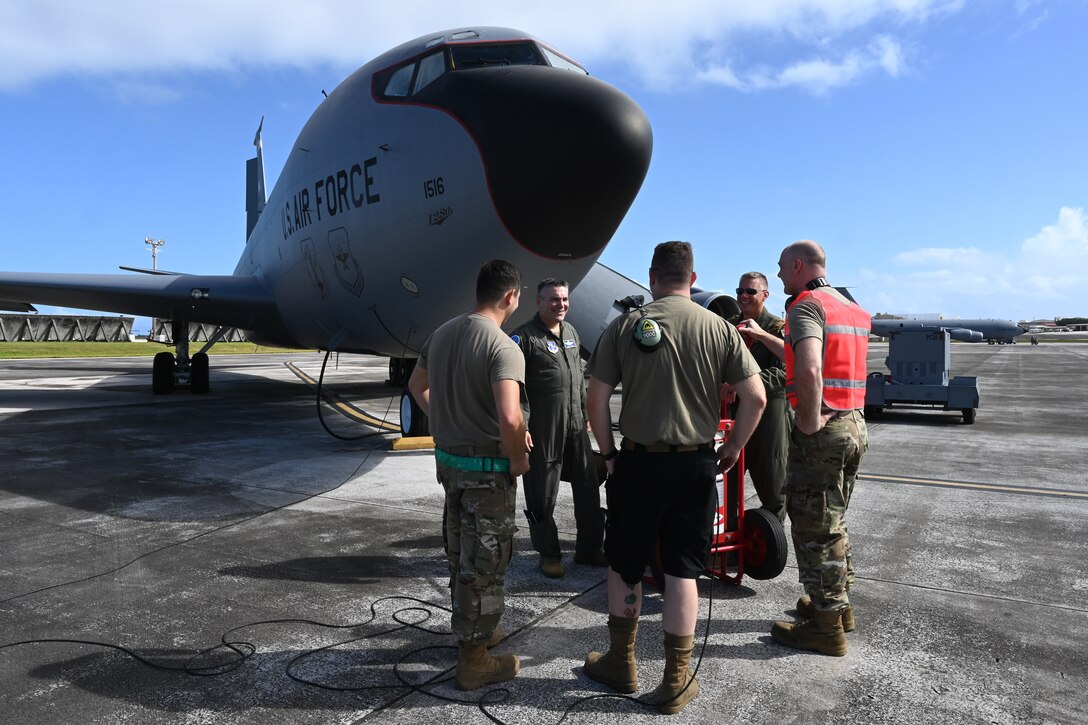U.S. Air Force Maj. Gen. Paul Knapp, adjutant general of the Wisconsin Air National Guard, speaks with U.S. Air Force personnel before participating in an aerial refueling mission at Andersen Air Force Base, Guam, Feb. 3, 2023.