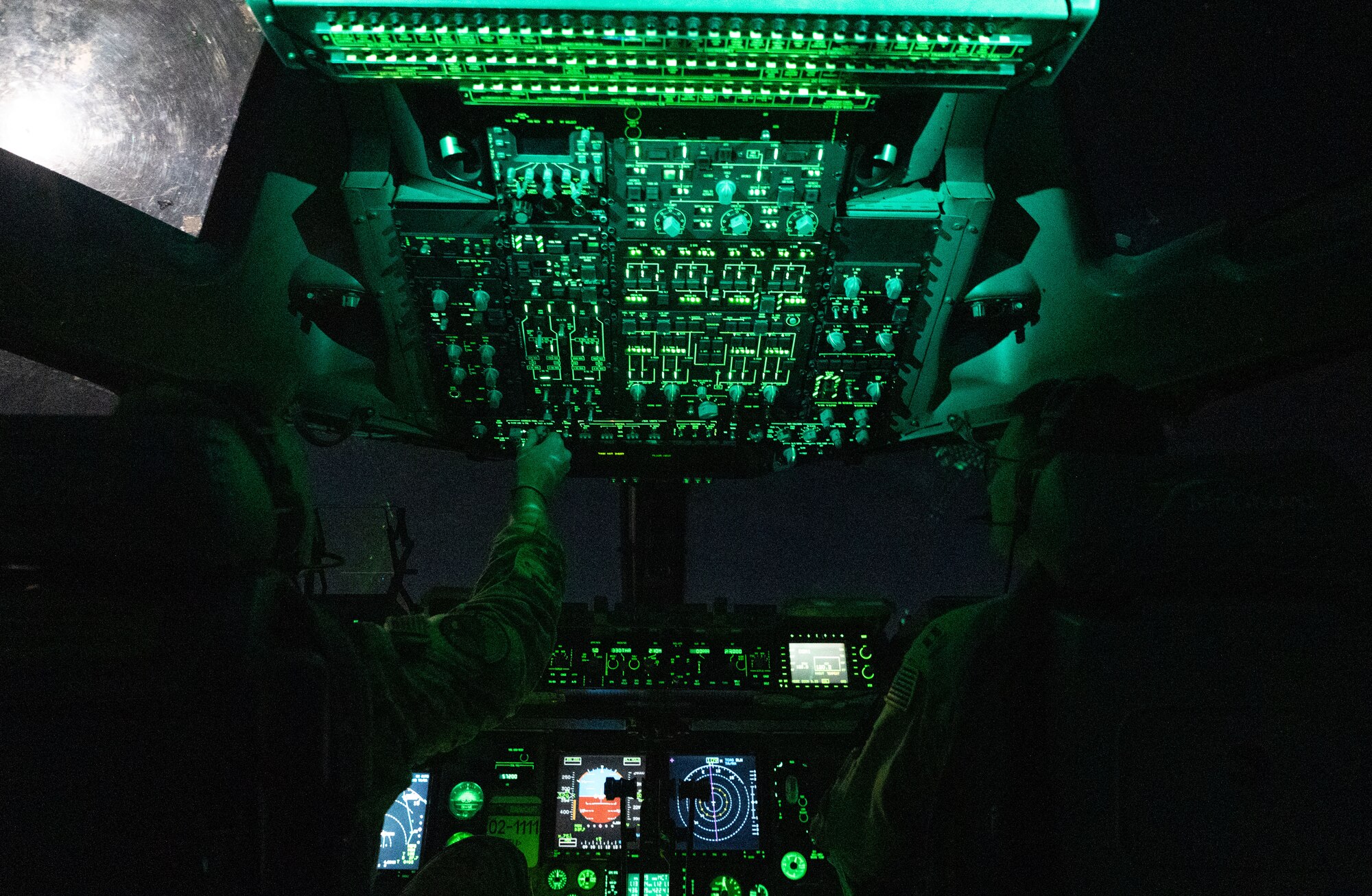 Photo of pilots approaching a runway at night