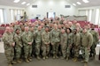 Maj. Gen. Susan Henderson, commanding general of the 377th Theater Sustainment Command, gather with deploying Soldiers of the 143d Expeditionary Sustainment Command (ESC). 143d ESC will serve as the forward operational command post for the 1st Theater Sustainment Command and be critical to supporting three named operations in the U.S. Central Command area of responsibility: Spartan Shield, Inherent Resolve, and Enduring Sentinel. (U.S. Army Reserve photo by 2nd Lt. Delphina Djeumeni)