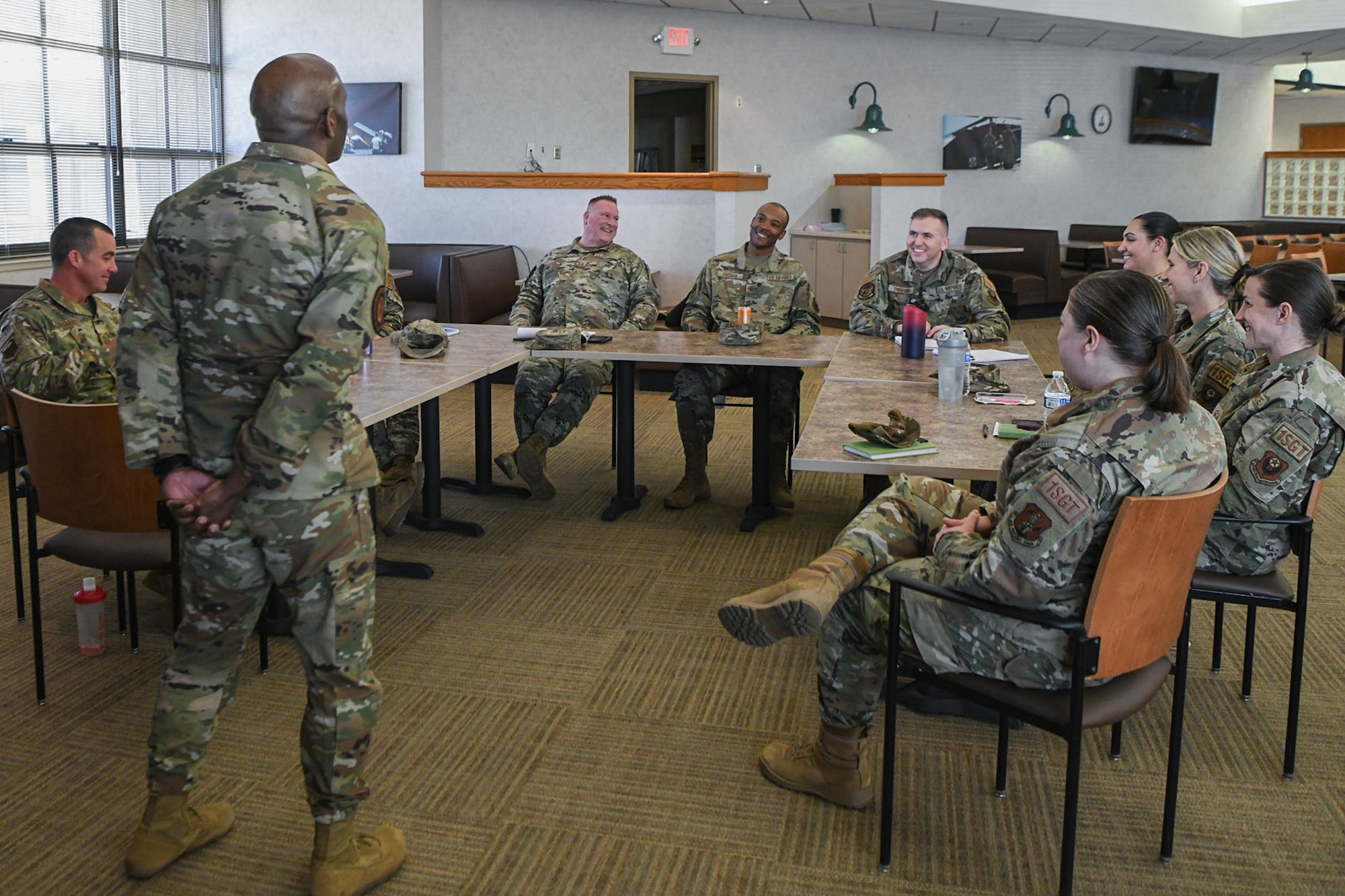 airmen speak to chief master sgt during round table talk