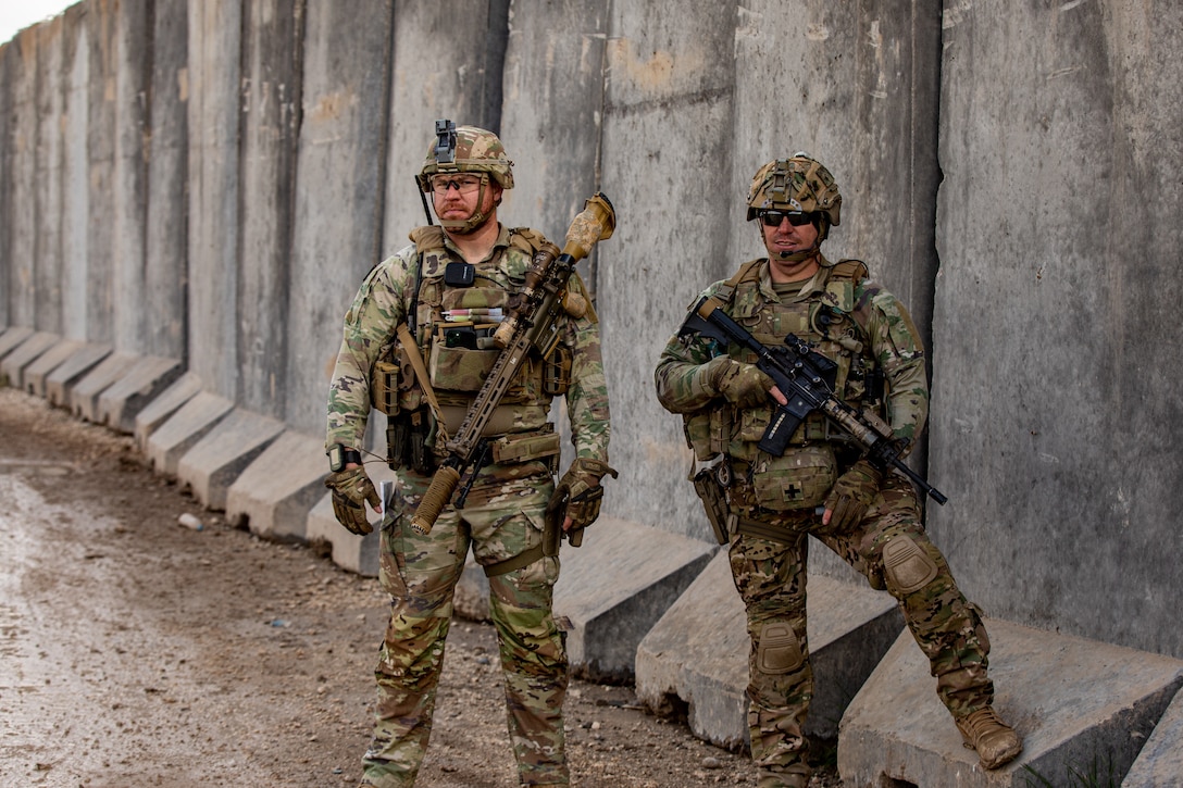 U.S. Army Sgt. Robert Russell and Staff Sgt. Dexter Robertson, assigned to Bravo Company, 1st Battalion, 118th Infantry Regiment, 37th Infantry Brigade Combat Team, Combined Joint Task Force - Operation Inherent Resolve, prior to a patrol, Syria, Feb. 3, 2023. The 118th Infantry Regiment is a part of the U.S. Army National Guard based in South Carolina. (U.S. Army photo by Sgt. Julio Hernandez)