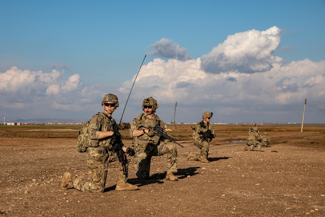 U.S. Army Spc. Alex Martin and 1st Lt. Zac Thompson, assigned to Bravo Company, 1st Battalion, 118th Infantry Regiment, 37th Infantry Brigade Combat Team, Combined Joint Task Force - Operation Inherent Resolve, pause for accountability during a patrol, Syria, Feb. 3, 2023. The 118th Infantry Regiment is a part of the U.S. Army National Guard based in South Carolina. (U.S. Army photo by Sgt. Julio Hernandez)