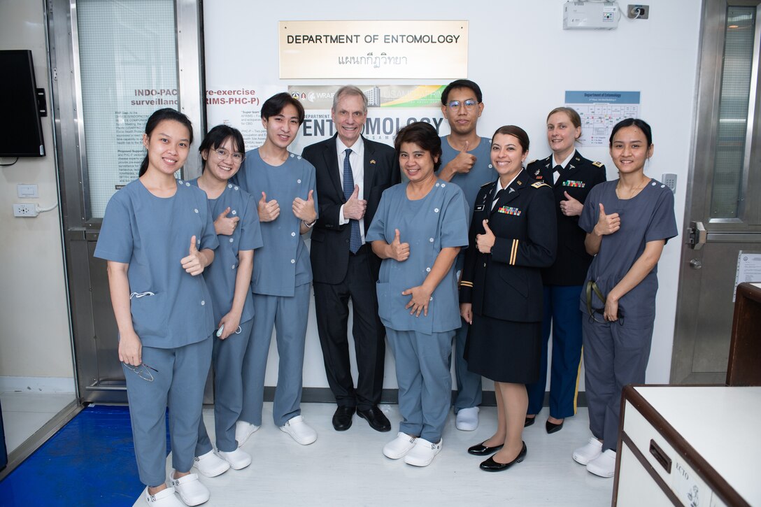 U.S. Ambassador and the Thai Deputy Prime Minister vis a lab at the U.S. Army Medical Directorate - Armed Forces Institute of Medical Sciences.