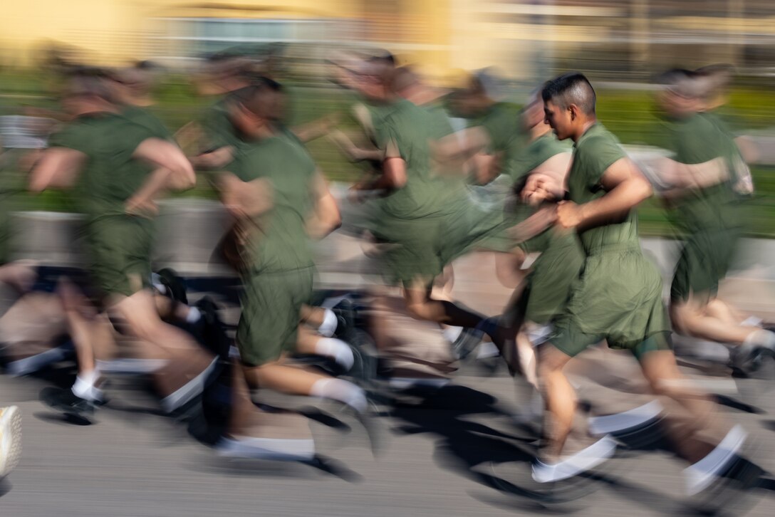 A group of Marines run together.