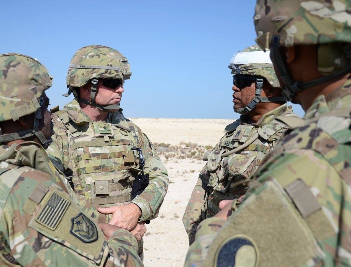 Brig. Gen. Walter L. Mercer, left, visits with Command Sgt. Maj. Irving Reed Jr, right, Dec. 9, 2016, in Qatar. The Soldiers serve as security forces as various sites in Qatar. (Photo by Sgt. 1st Class Terra C. Gatti, 116th Military Engagement Team)