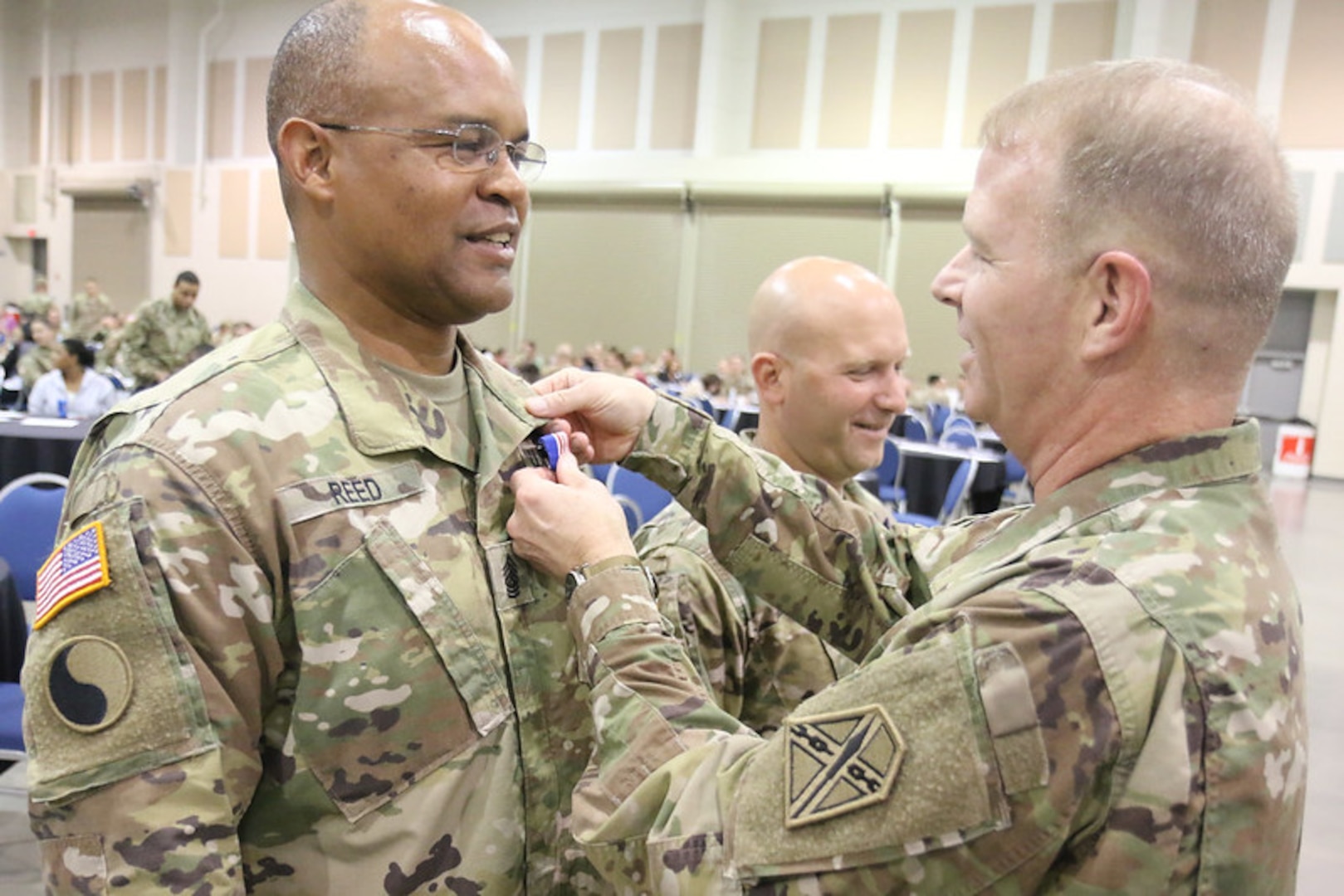 Maj. Gen. Timothy P. Williams, the Adjutant General of Virginia, presents Command Sgt. Maj. Irving Reed Jr. with the  Governor's National Service Medal May 21, 2017, in Roanoke, Virginia, in recognition of his federal active duty service conducting security operations in Qatar from May 2016 to April 2017. The battalion and several companies also were recognized with national- and state-level training readiness awards. (U.S. National Guard photo by Cotton Puryear)