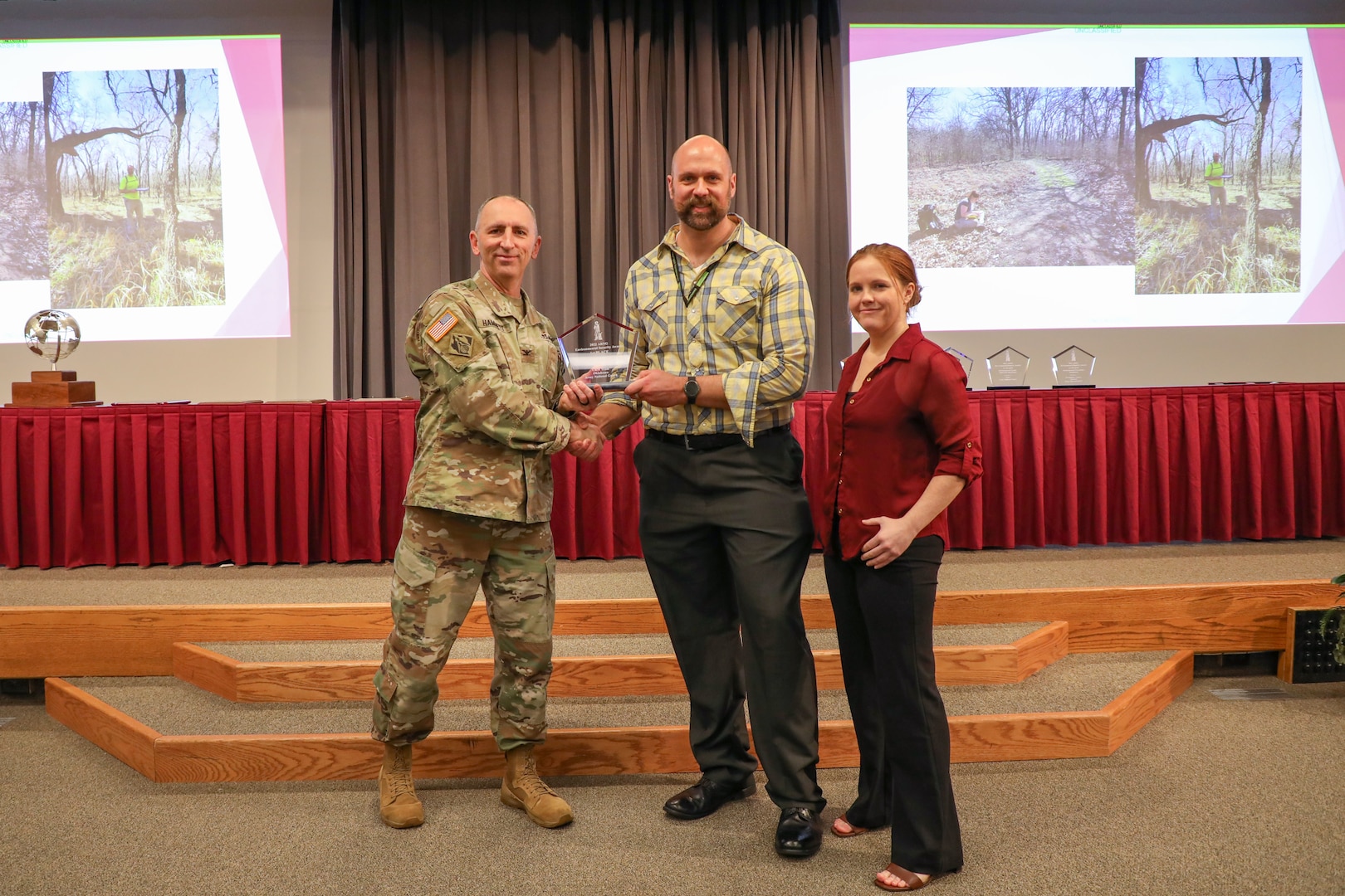 Members of the Oklahoma Army National Guard Cultural Resources Management Team accept their 1st Place award in a ceremony held at Camp Robinson, Arkansas, Jan. 24.