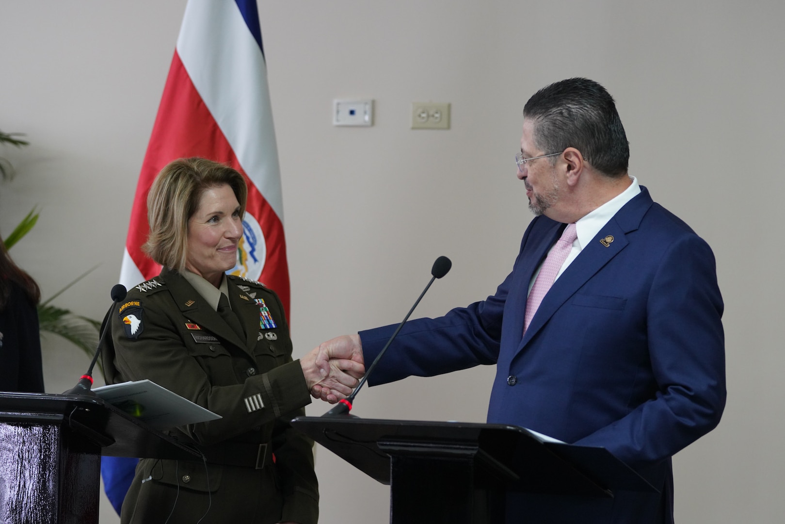 U.S. Army Gen. Laura Richardson, the commander of U.S. Southern Command, shakes hands with Costa Rican President Rodrigo Chaves Robles.