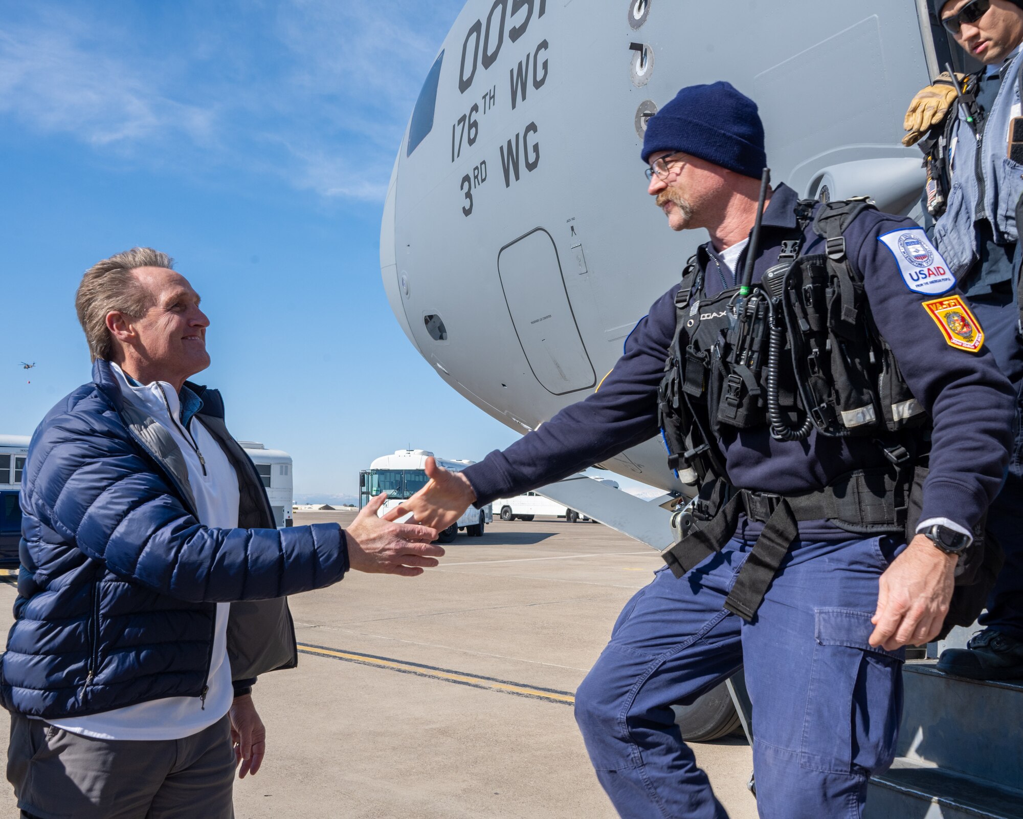 U.S. Ambassador Jeffry Flake, U.S. Ambassador to Türkiye, left, shakes hands with a member of the United States Agency for International Development’s Disaster Assistance Response Team, right, during their arrival at Incirlik Air Base, Türkiye, Feb 8, 2023. Ambassador Flake visited Incirlik AB to greet members of the USAID team, following a series of earthquakes that struck central-southern Türkiye on Feb 6, 2023. As Ambassador to Türkiye, Flake holds the highest civilian position as The Chief of Mission, and impacts the communication and resources of U.S. personnel, advancing the U.S. foreign policy goals. As a fellow NATO ally, the U.S. Government mobilized personnel to assist in Türkiye in their response efforts. (U.S. Air Force photo by Senior Airman David D. McLoney)
