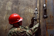 A1C Nathan Boley, 791st Maintenance Squadron assists in performing a Transporter Erector Semitrailer Hoist Assembly replacement with a team of Airmen July 12, 2022, Minot Air Force Base, North Dakota. The 791st MXS help to support Minot Air Force Base’s mission by ensuring the ability to retain our deterrence from our adversaries. (U.S. Air Force photos by Airman Alysa Knott)