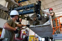 A1C Nathan Boley, 791st Maintenance Squadron assists in performing a Transporter Erector Semitrailer Hoist Assembly replacement with a team of Airmen July 12, 2022, Minot Air Force Base, North Dakota. The 791st MXS help to support Minot Air Force Base’s mission by ensuring the ability to retain our deterrence from our adversaries. (U.S. Air Force photos by Airman Alysa Knott)