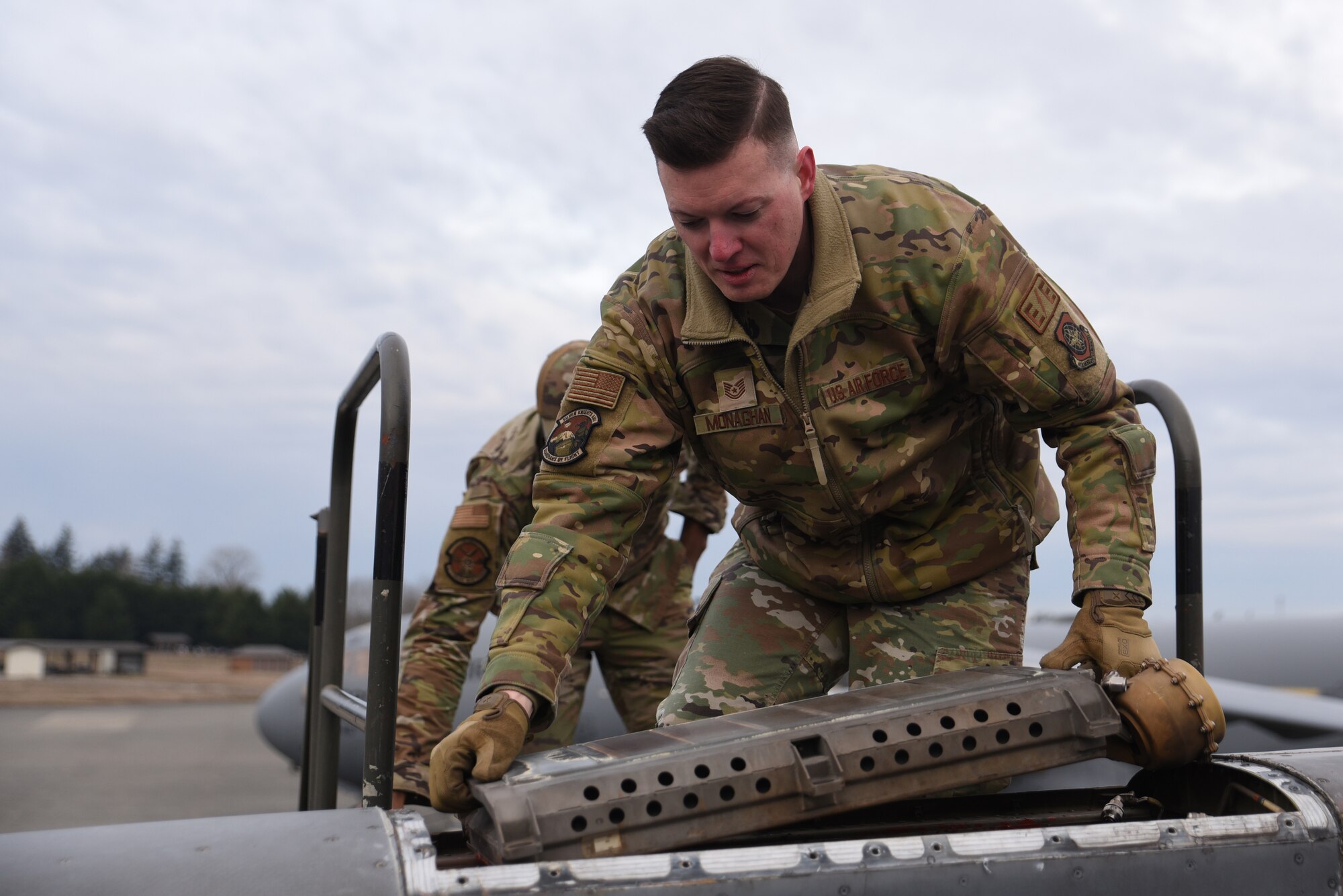 U.S. Air Force Tech. Sgt. Sean Monaghan, NCO in charge of electrical and environmental with the 62d Aircraft Maintenance Squadron, installs a fan air valve on a C-17 Globemaster III at Joint Base Lewis-McChord, Washington, Feb. 3, 2023. Electrical and environmental Airmen are responsible for maintaining and repairing the wiring and electrical components on an aircraft to make sure they are in optimal working condition. (U.S. Air Force photo by Airman Kylee Tyus)
