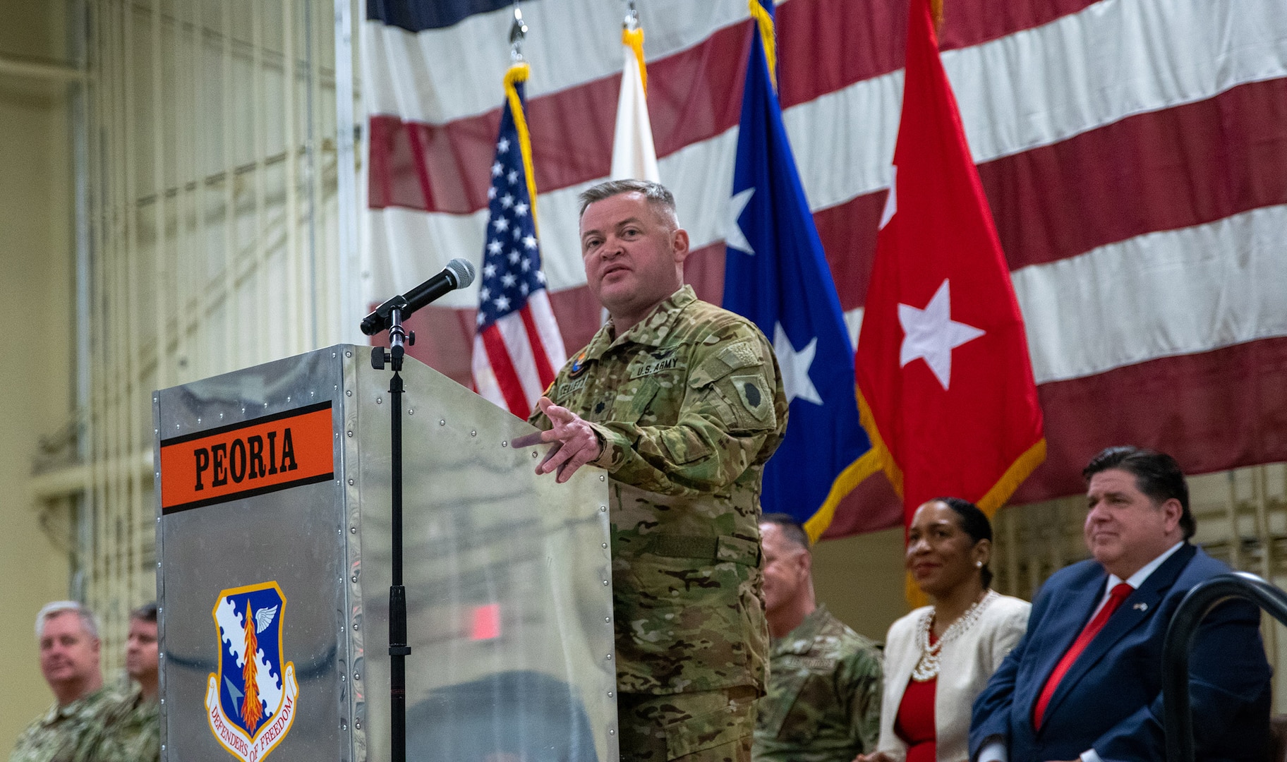 Lt. Col. Jason Celletti, commander, 1st Assault Helicopter Battalion, 106th Aviation Regiment, thanks friends and families for their support during the mobilization ceremony Feb. 7 at the 182nd Airlift Wing, Peoria.