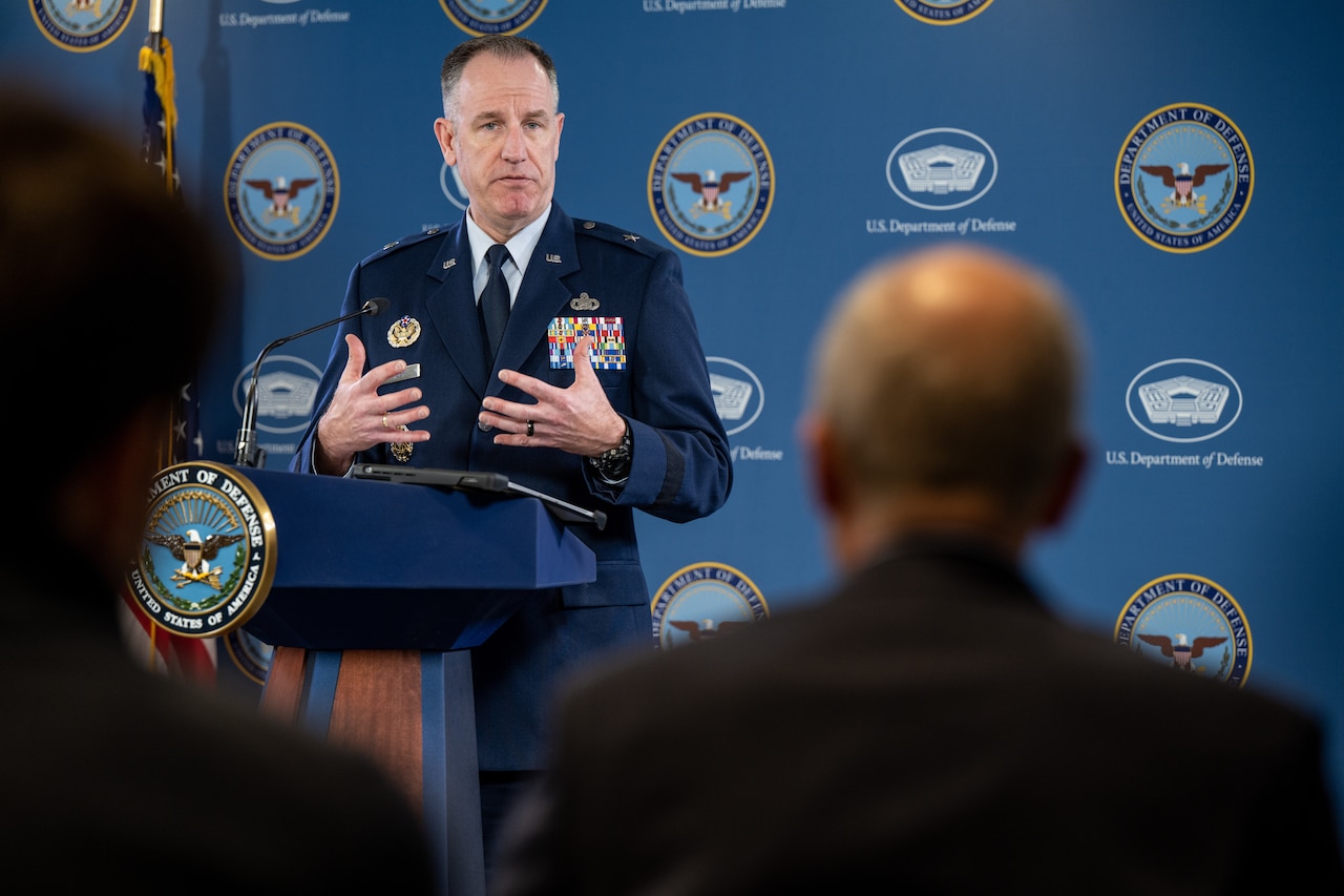 A man speaks from a podium.