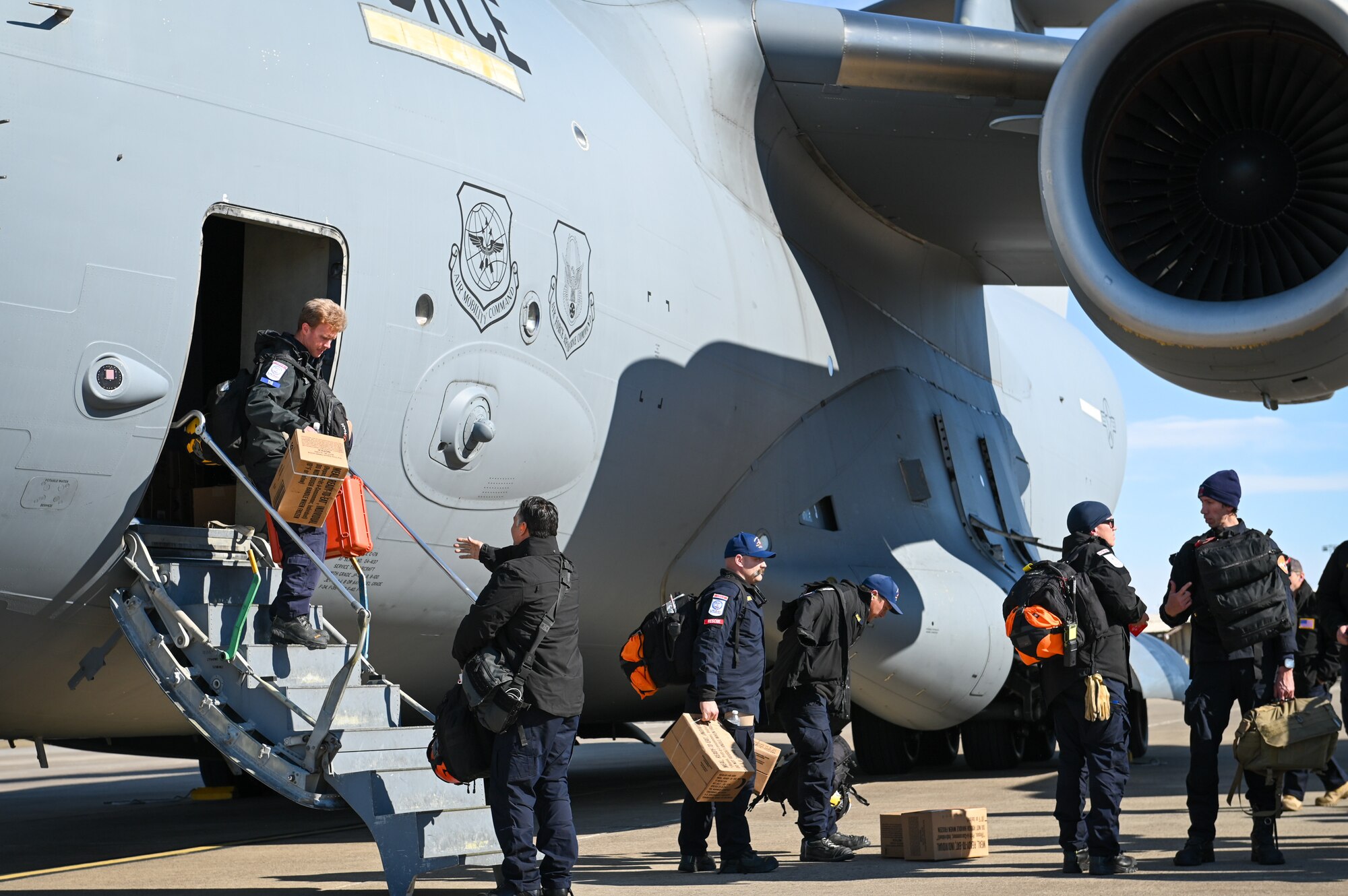 Members of the United States Agency for International Development’s Disaster Assistance Response Team unload cargo at Incirlik Air Base, Türkiye, Feb. 8, 2023. The DART is assigned to lead the U.S. government humanitarian response following a series of earthquakes that struck central-southern Türkiye on Feb. 6, 2023.