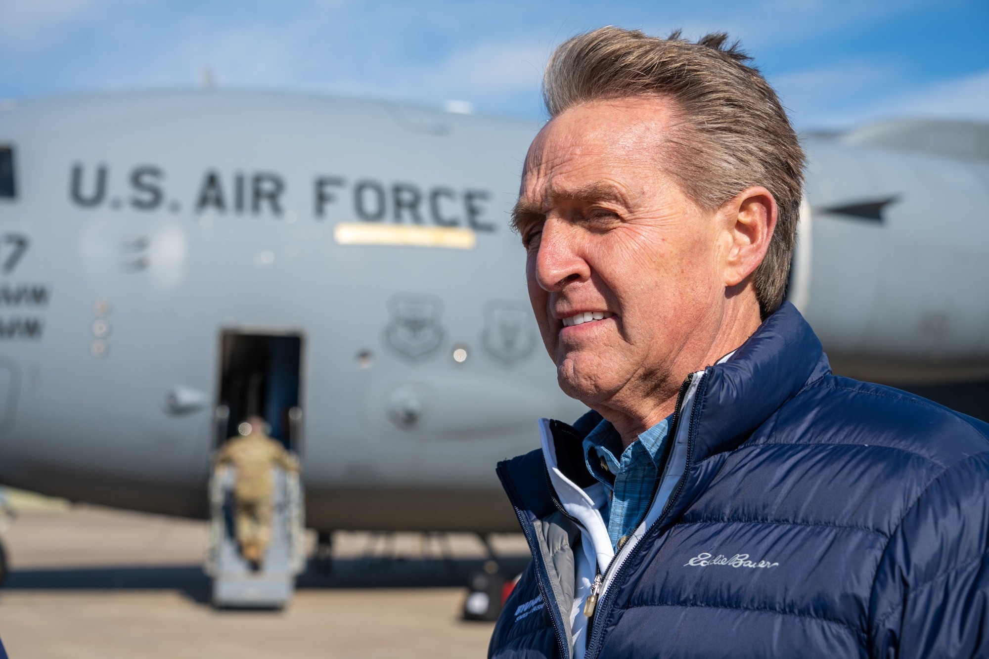 U.S. Ambassador Jeffry Flake, U.S. Ambassador to Türkiye, stands outside of a C-17 Globemaster III aircraft that carried members of the United States Agency for International Development’s Disaster Assistance Response Team to Incirlik Air Base, Türkiye, Feb 8, 2023. Ambassador Flake visited Incirlik AB to greet members of the USAID team, following a series of earthquakes that struck central-southern Türkiye on Feb 6, 2023. As Ambassador to Türkiye, Flake holds the highest civilian position as The Chief of Mission, and impacts the communication and resources of U.S. personnel, advancing the U.S. foreign policy goals. As a fellow NATO ally, the U.S. Government mobilized personnel to assist in Türkiye in their response efforts. (U.S. Air Force photo by Senior Airman David D. McLoney)