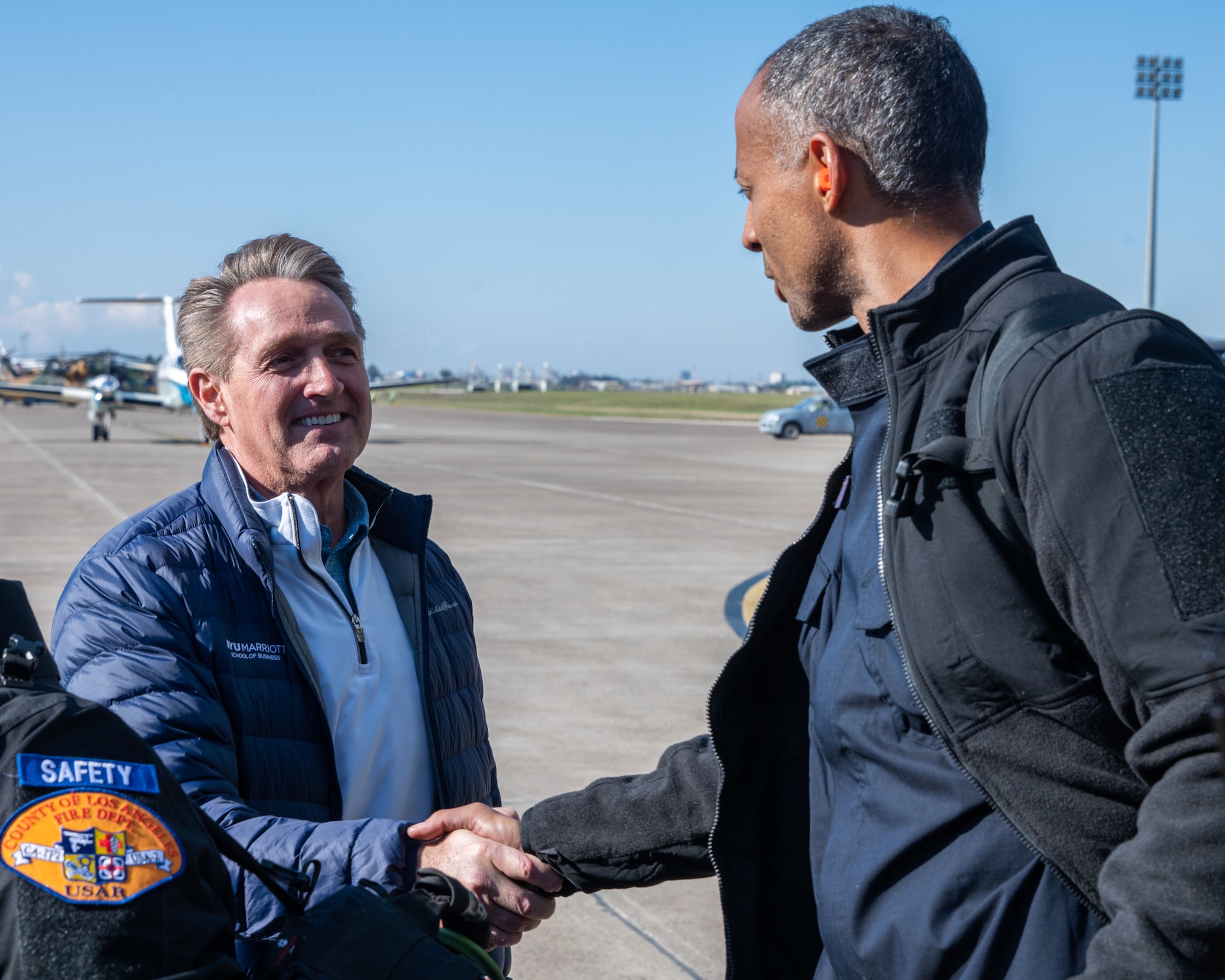 U.S. Ambassador Jeffry Flake, U.S. Ambassador to Türkiye, left, shakes hands with a member of the United States Agency for International Development’s Disaster Assistance Response Team, right, during their arrival at Incirlik Air Base, Türkiye, Feb 8, 2023. Ambassador Flake visited Incirlik AB to greet members of the USAID team, following a series of earthquakes that struck central-southern Türkiye on Feb 6, 2023. As Ambassador to Türkiye, Flake holds the highest civilian position as The Chief of Mission, and impacts the communication and resources of U.S. personnel, advancing the U.S. foreign policy goals. As a fellow NATO ally, the U.S. Government mobilized personnel to assist in Türkiye in their response efforts. (U.S. Air Force photo by Senior Airman David D. McLoney)