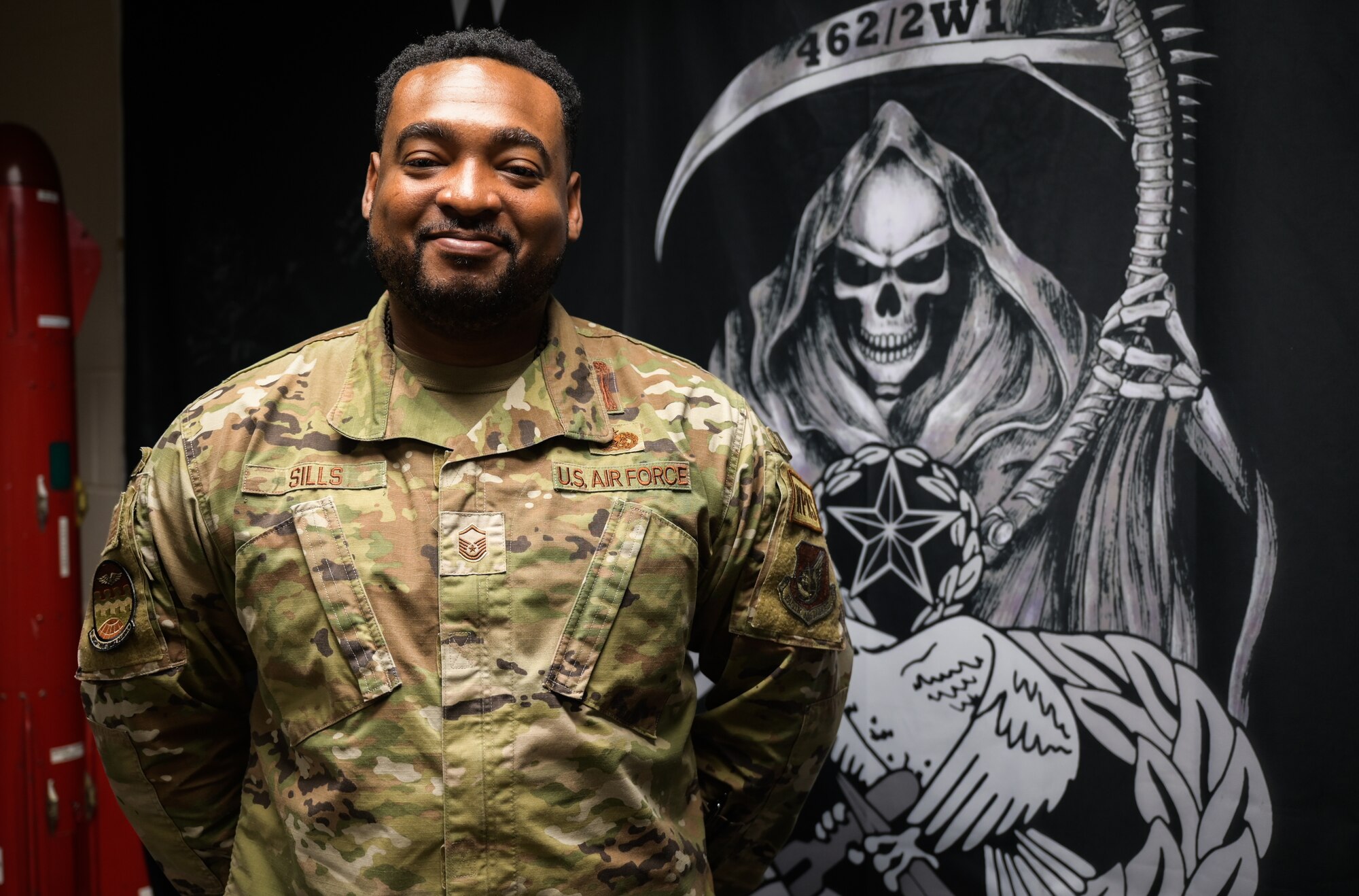 Master Sgt. James Sills IV, 15th Aircraft Maintenance Squadron weapons section chief, poses for a photo at Joint Base Pearl Harbor-Hickam, Hawaii, Feb. 7, 2023. Sills shared how he continues to overcome his neighborhood life expectancy of 21 years, showcasing his perseverance and utilizing his life experience through his leadership after 19 years of service. (U.S. Air Force photo by Staff Sgt. Alan Ricker)