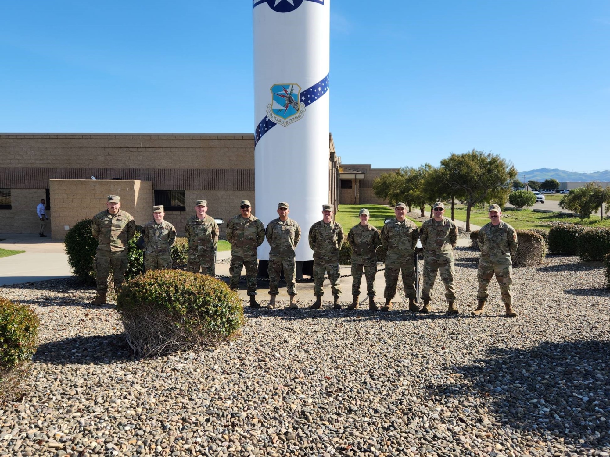 U.S. Airmen from the 791st Missile Maintenance Squadron (MMXS) pose for a photographer at Vandenberg Space Force Base, California. The 791st MMXS Airmen help ensure the Minute Man III meets operational standards. (Courtesy photo)