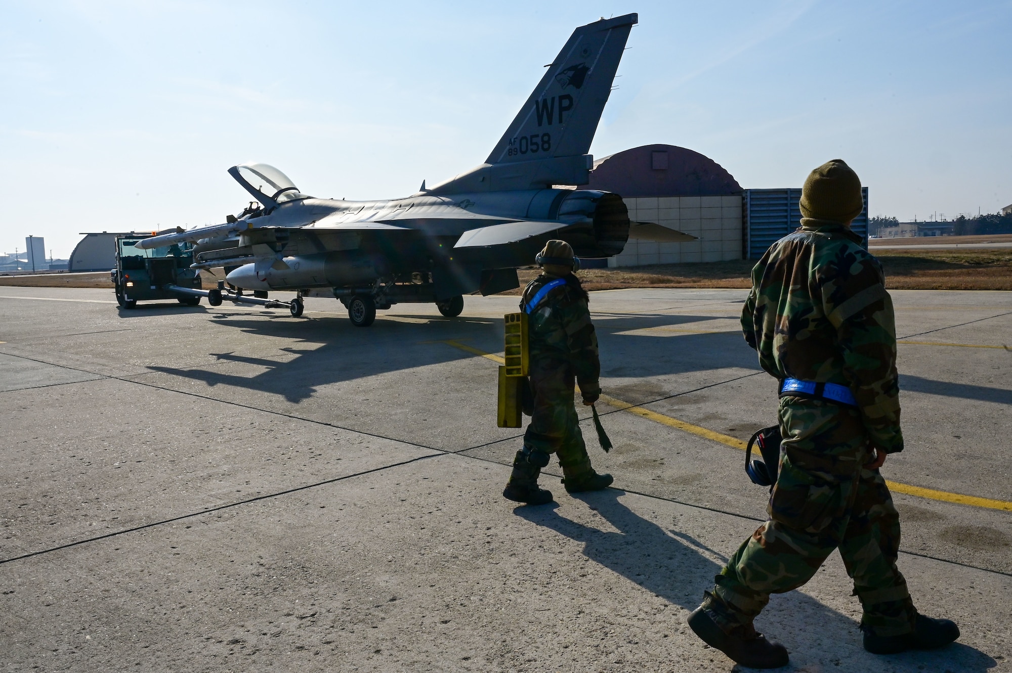 U.S. Air Force Airman 1st Class Katelyn Chavez, 35th Fighter Generation Squadron (FGS) weapons load crew member (left), and Staff Sgt. Markanthony Pace, 35th FGS weapons load crew chief, conduct rapid response cross utilization training with an F-16 Fighting Falcon after a sortie, during a training event on Kunsan Air Base, Republic of Korea, Feb. 8, 2023. The 35th Fighter Squadron, which is supported by the 35th FGS, flew around-the-clock operations alongside the 80th Fighter Squadron and the Republic of Korea Air Force’s 38th Fighter Group. (U.S. Air Force photo by Tech. Sgt. Timothy Dischinat)