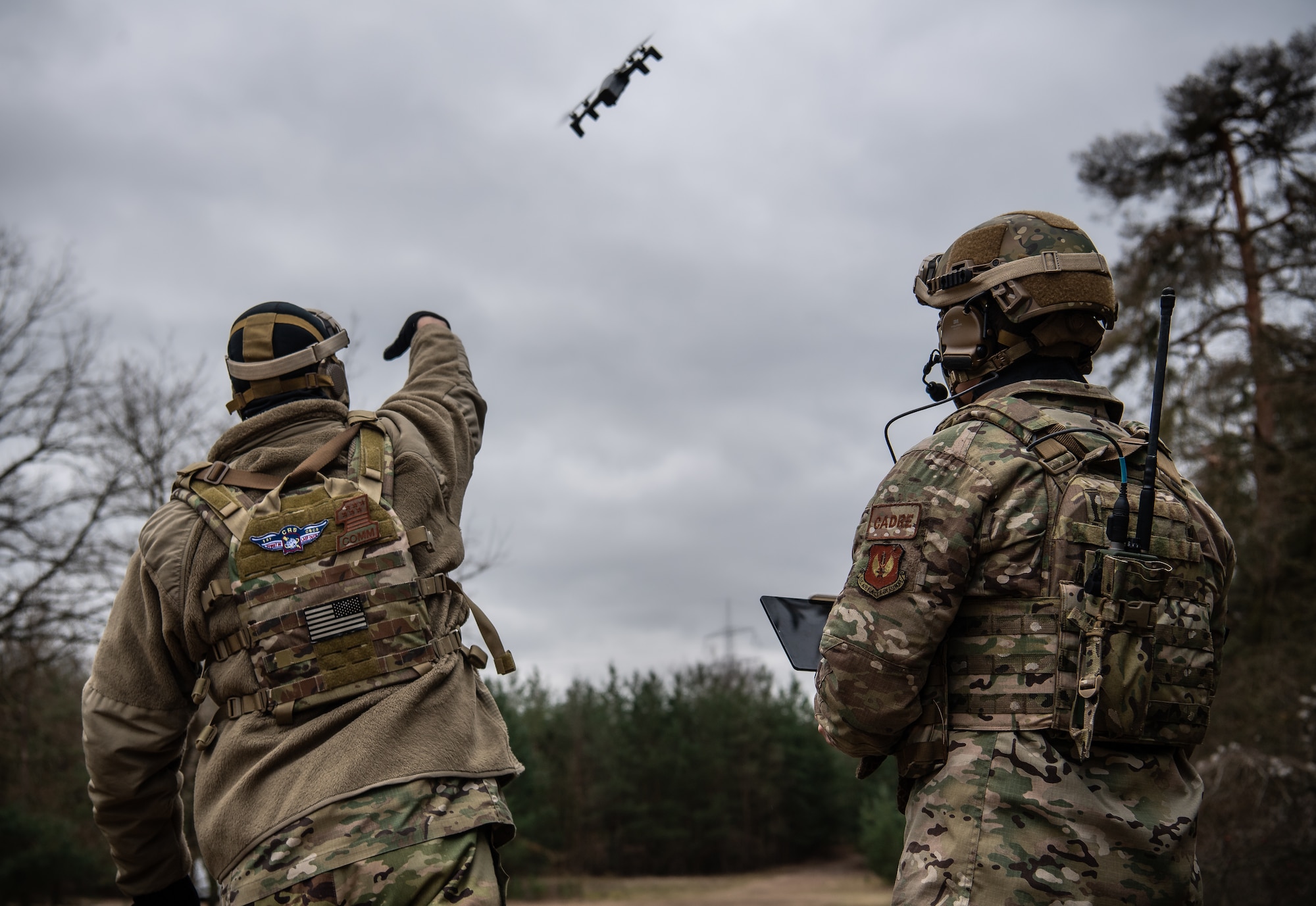 man throws drone