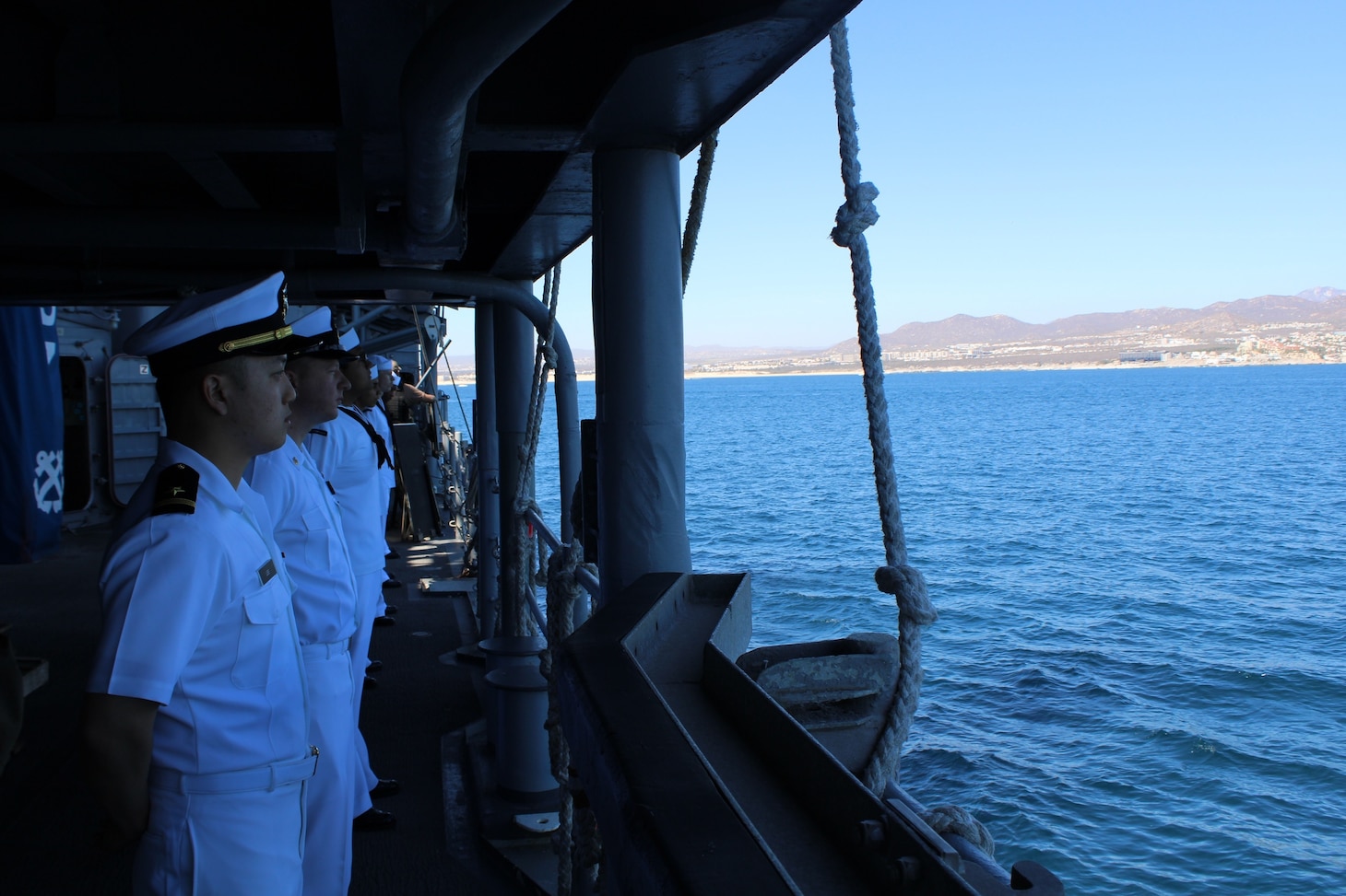 Sailors man-the-rails during an anchoring evolution aboard Ticonderoga-class guided-missile cruiser USS Lake Champlain (CG 57) while pulling into Cabo San Lucas, Mexico, for a port visit, Feb. 5. Lake Champlain is homeported in San Diego.