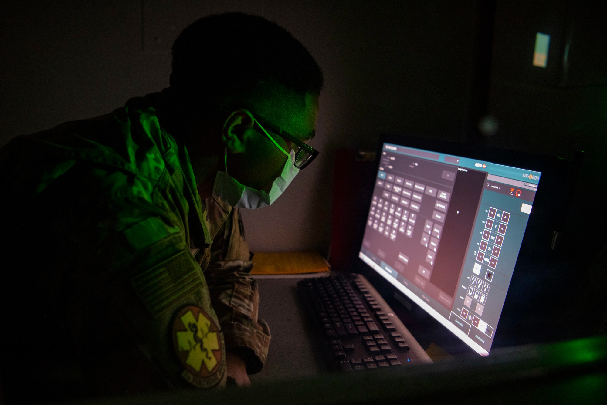 U.S. Air Force Staff Sgt. Edward Smith, 7th Health Care Operations Squadron diagnostic imaging technologist, reviews a program during an X-ray machine demonstration at Dyess Air Force Base, Texas, Feb. 8, 2023. The Dyess Radiology Clinic ensures military personnel and their families receive quality health care by taking X-ray images that are digitally transmitted through the picture archiving and communication system to be read by a radiologist at Travis AFB, California. (U.S. Air Force photo by Airman 1st Class Ryan Hayman)