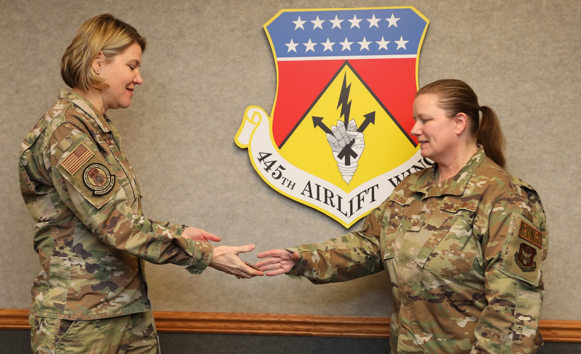 Maj. Gen. C. McCauley von Hoffman is the Director of Logistics, Civil Engineering, Force Protection and Nuclear Integration, Headquarters Air Force Materiel Command, coins Tech. Sgt. Wendy Glover, 445th Logistics Readiness Squadron logistics planner, for being an outstanding performer Jan. 8, 2023. Five Airmen were coined by the general for being their group’s outstanding performer; three from the 445th Maintenance Group and two from the 445th Mission Support Group. While at the wing, the general received an overview briefing from both the 445th MSG and MXG, she met with 21X officers during a senior leader perspective discussion, had lunch with both 445th MXG and MSG leadership and toured various maintenance facilities.