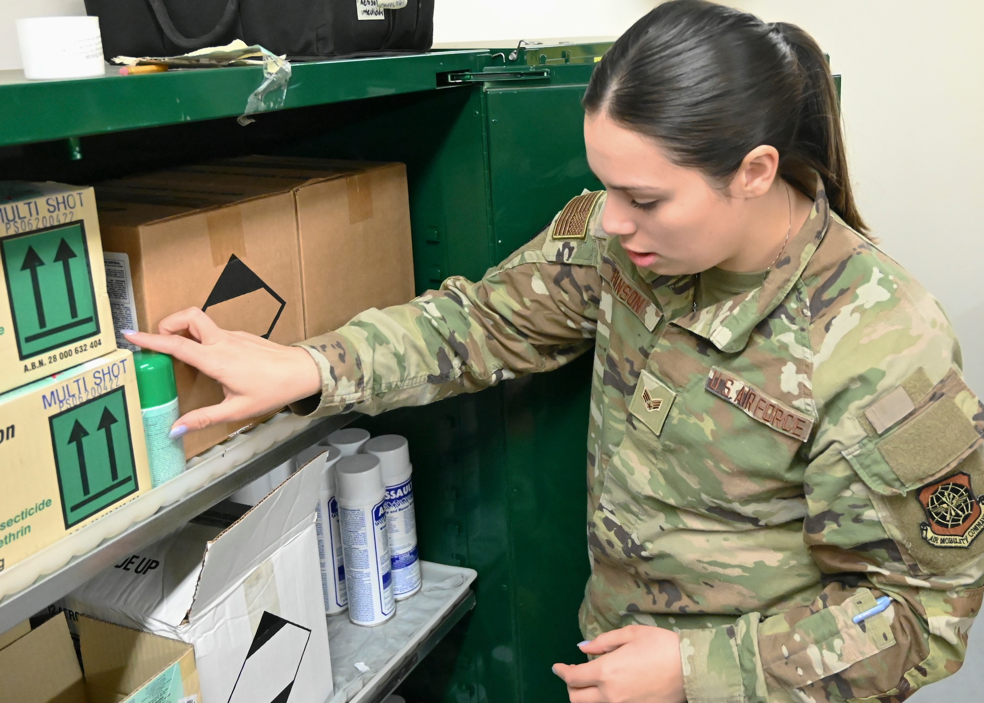 Insecticides are properly stored with caution signs in the pest management shop at Joint Base Lewis-McChord, Washington, Feb. 6, 2023. The chemicals stored here are used to spray the interior of an aircraft to prevent the transfer of mosquitos carrying the Zika virus to other countries.  (U.S. Air Force photo by Senior Airman Callie Norton)