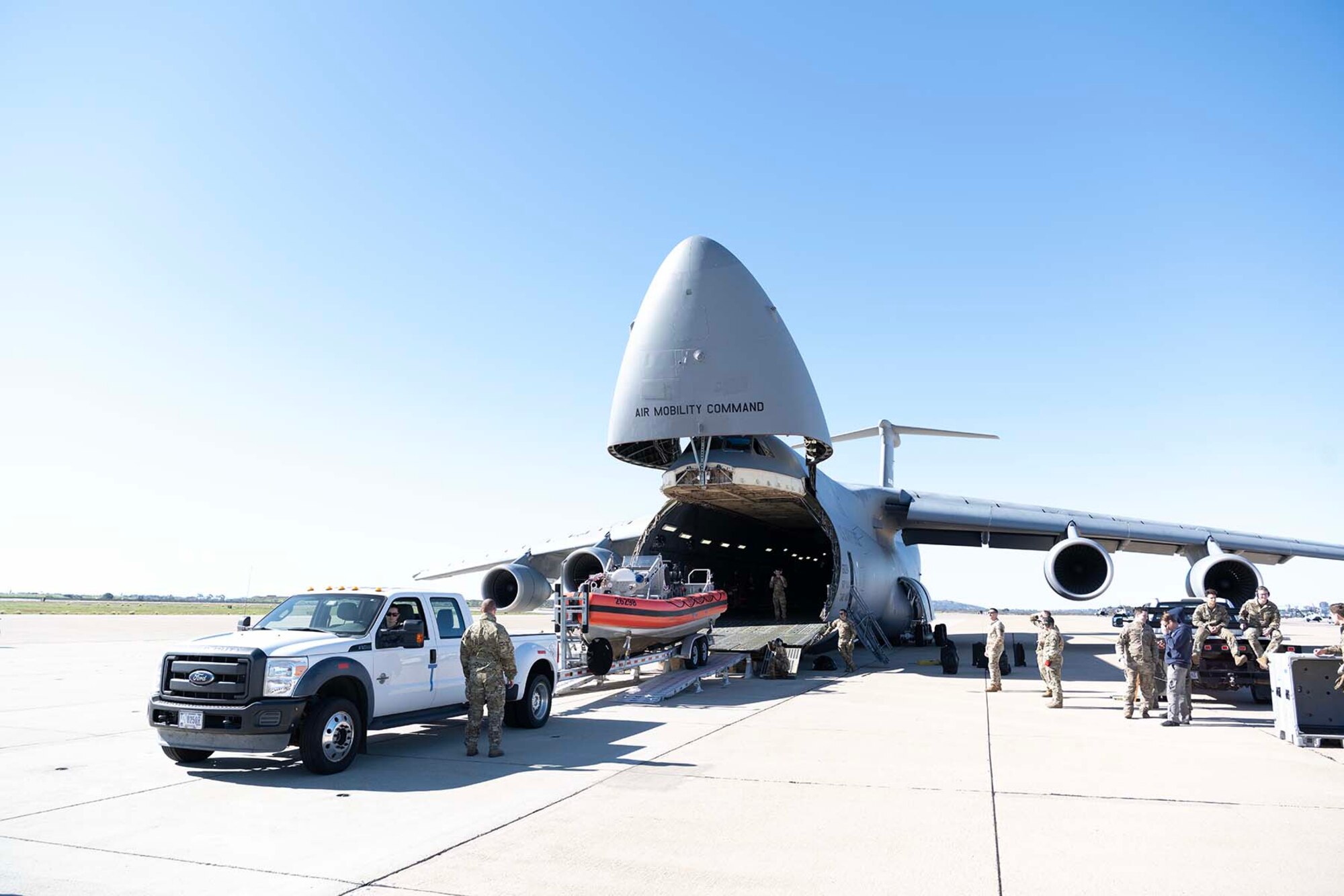 A vehicle is backed up into a large airplane