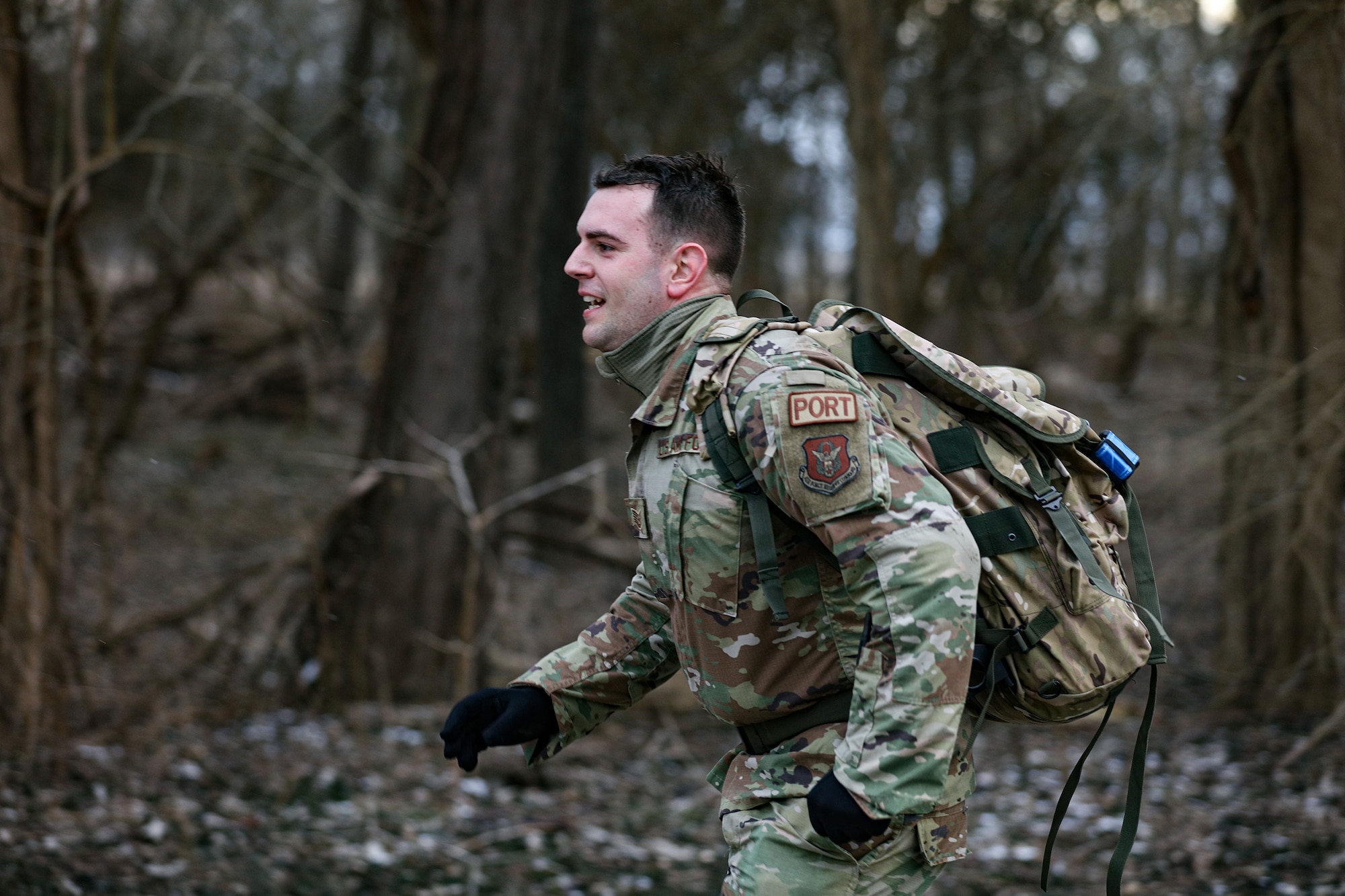 Tech. Sgt. Gabriel Clark, 87th Aerial Port Squadron ramp operations representative, pushes through a 12k ruck-march during the German Armed Forces Military Proficiency Badge qualification at Wright-Patterson Air Force Base, Ohio, Feb. 3, 2023. He finished the event with a 1:37:50 runtime.