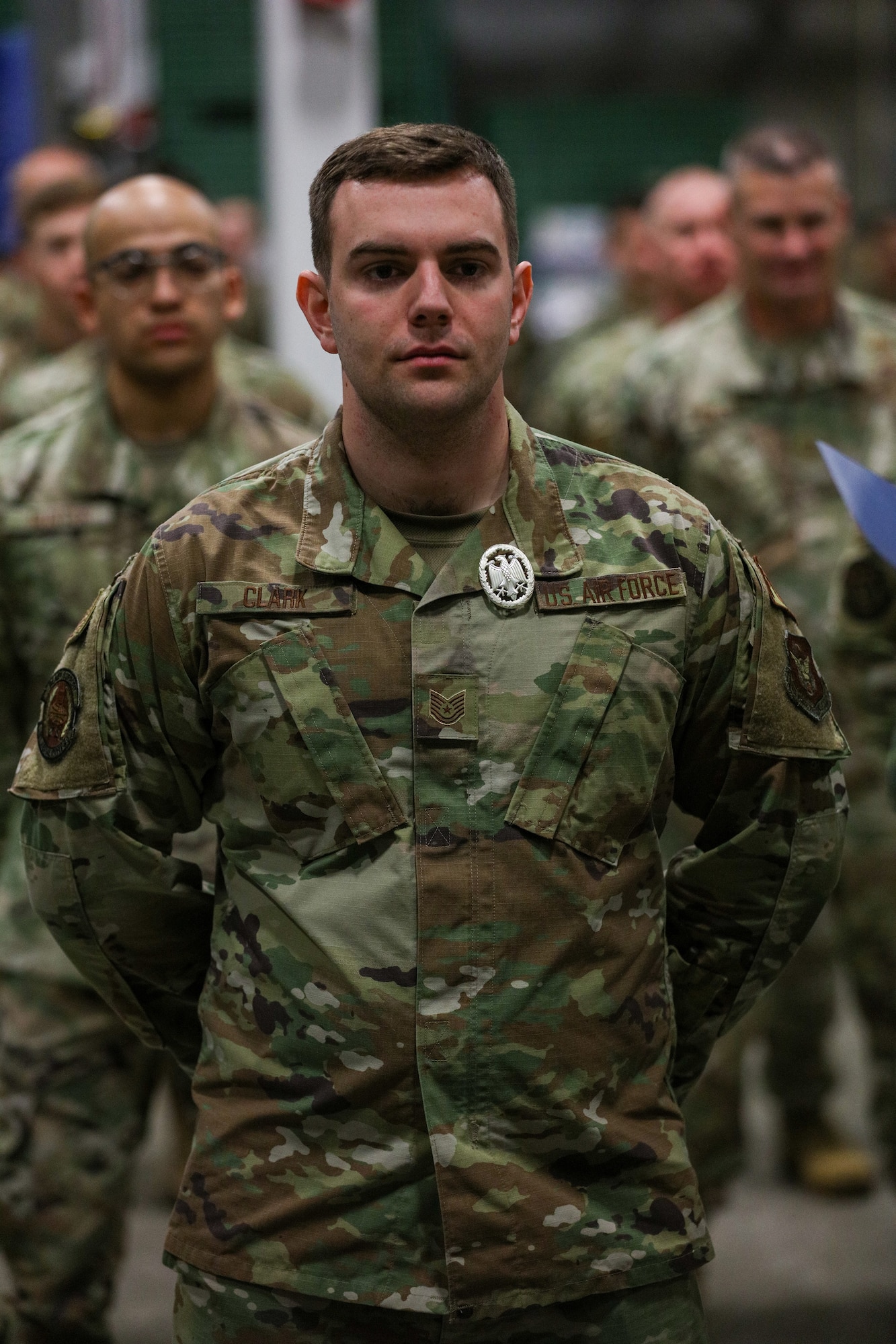 Tech. Sgt. Gabriel Clark, 87th Aerial Port Squadron ramp operations representative, is awarded the silver badge after completing the German Armed Forces Military Proficiency Badge qualification test at Wright-Patterson Air Force Base, Ohio, Feb. 3, 2023.