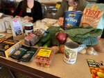 A table of healthy food options on display for attendees to view.