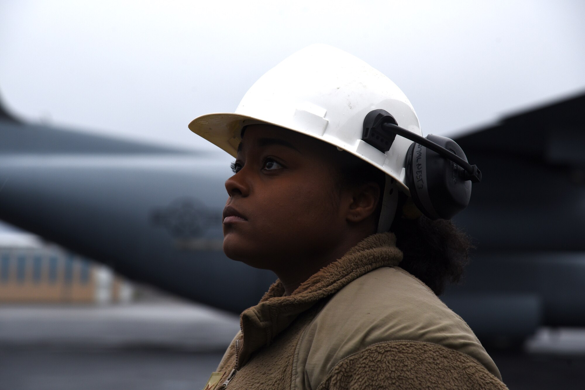 Female Airman stands by as a safety spotter.