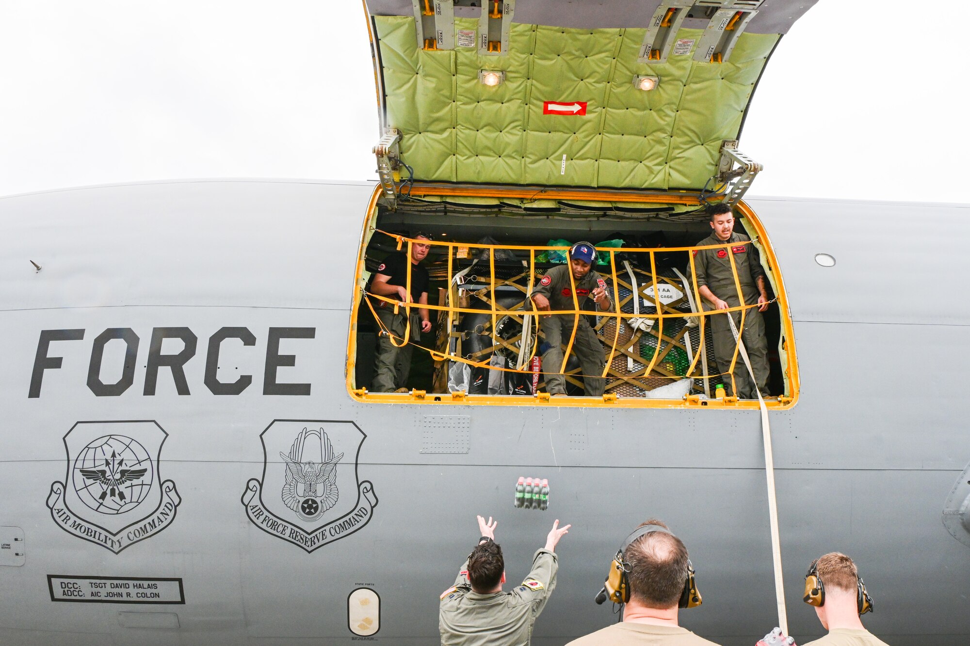 Aircrew from the 50th Air Refueling Squadron, MacDill Air Force Base, load Brazilian beverages onto a KC-135 Stratotanker in Rio de Janeiro, Brazil, Jan. 24, 2023. During the course of seven days, two KC-135 Stratotankers stopped in Brazil as they circumnavigated the Southern Hemisphere during an unprecedented endurance mission. (U.S. Air Force photo by 2nd Lt. Kristin Nielsen)