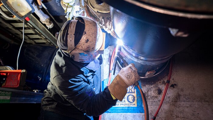 A welder performs repairs to a pipe in the Red Hill Bulk Fuel Storage Facility (RHBFSF) in Halawa, Hawaii, Feb. 8, 2023. Joint Task Force-Red Hill is currently in phase three of its five-phase defueling plan, where contractors and employees will be completing repairs and upgrades which will ensure a safe and expeditious defueling of the RHBFSF. (U.S. Army photo by Spc. Matthew Mackintosh)