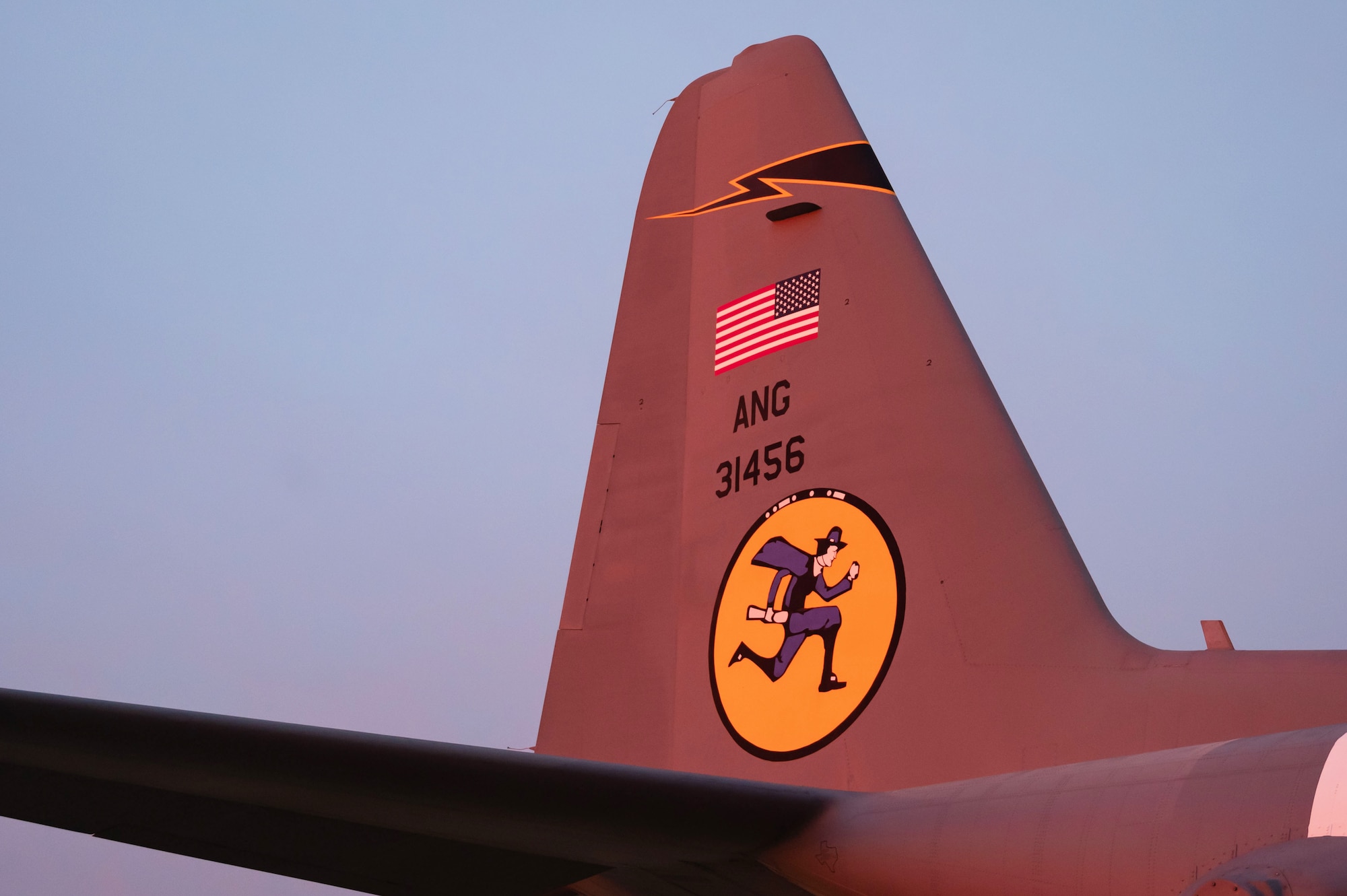 A C-130H aircraft, painted to commemorate the 100th anniversary of the 118th Airlift Squadron, Flying Yankees, sits on the flight line at sunrise, January 18, 2023 at Bradley Air National Guard Base, Conn. Members of the 103rd Maintenance Group, Connecticut Air National Guard painted the aircraft. (U.S. Air National Guard photo by Master Sgt. Tamara R. Dabney)