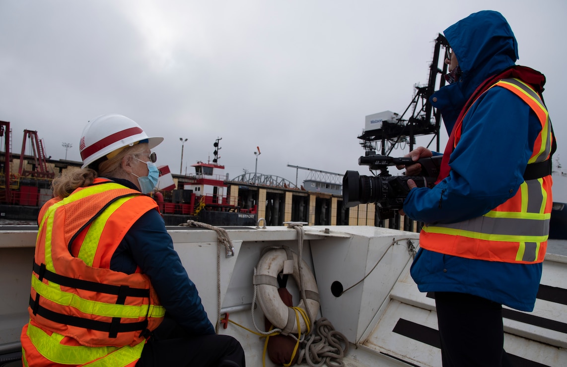Julie Anderson, Operations Branch chief, participates in a media interview at the Port of Alaska in Anchorage. The public affairs office facilitates engagements like these to inform the public on Army activities.