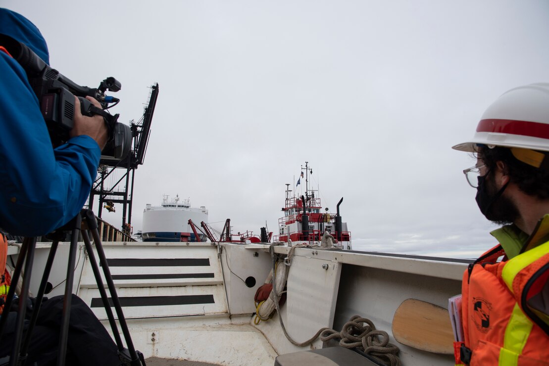 John Budnik, public affairs specialist (right), facilitates a media interview at the Port of Alaska in Anchorage.