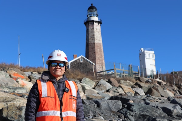 Project Manager Shewen Bian stands in front of Montauk Lighthouse
