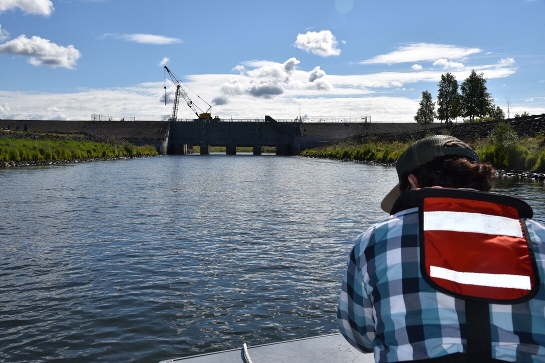 John Budnik, public affairs specialist, captures video of the Moose Creek Dam for a public service announcement about the Chena River Lakes Flood Control Project in North Pole, Alaska. The video explains the role of the Moose Creek Dam in protecting the Fairbanks community from seasonal flooding.