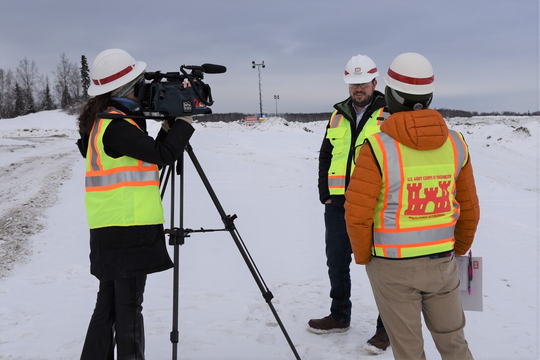 Clinton "Daly" Yates, project manager at the U.S. Army Corps of Engineers - Alaska District, conducts a media interview about the 16/34 runway extension on Joint Base Elmendorf-Richardson. The $309 million project requires the excavation of 12 million cubic yards of soil. Since construction efforts began in the fall, contractors have excavated 1.3 million cubic yards of soil.