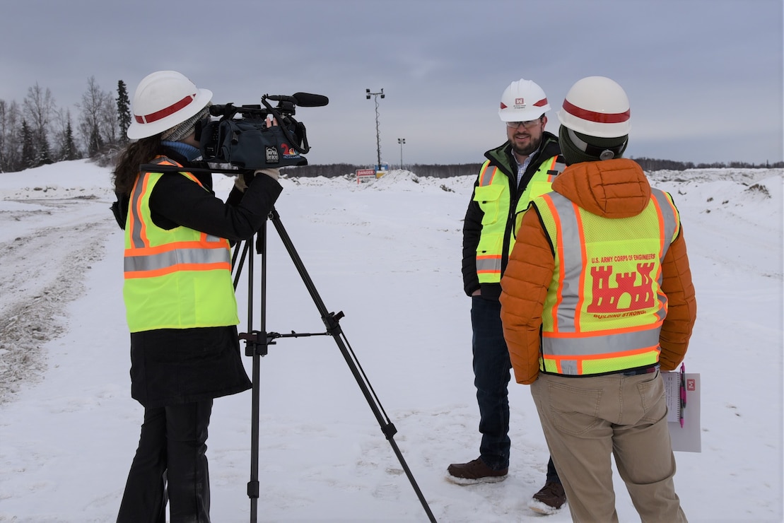 Clinton "Daly" Yates, project manager at the U.S. Army Corps of Engineers - Alaska District, conducts a media interview about the 16/34 runway extension on Joint Base Elmendorf-Richardson. The $309 million project requires the excavation of 12 million cubic yards of soil. Since construction efforts began in the fall, contractors have excavated 1.3 million cubic yards of soil.